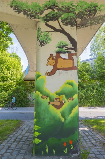 Graffiti under bridge with monkey and banana