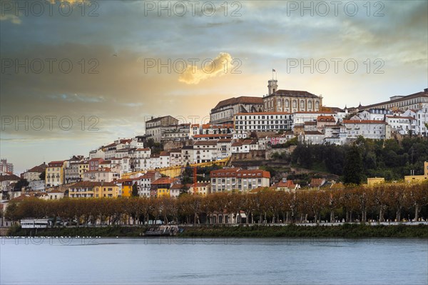 Coimbra cityscape with Mondego river by sunset