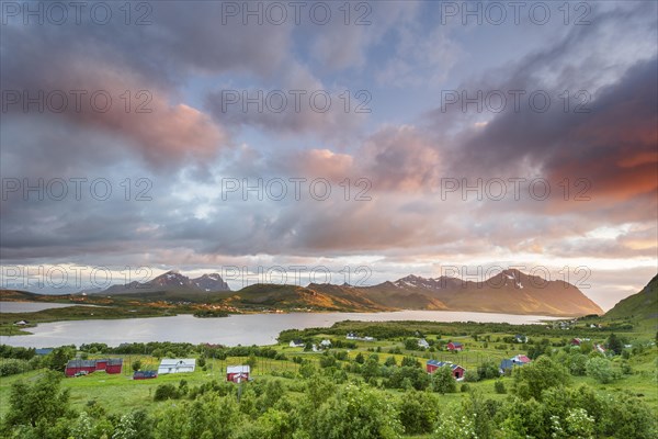 View over the lake Ytterpollen near Borg in the evening mood with pink clouds