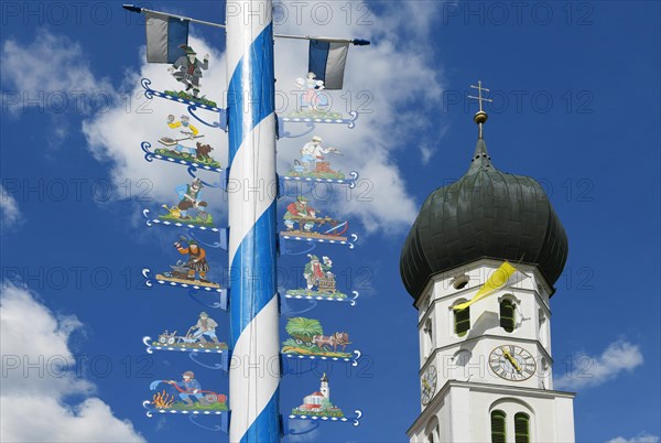 Maypole and church St. Benedikt