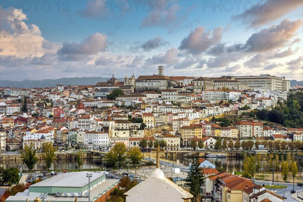 Coimbra cityscape with Mondego river by sunset