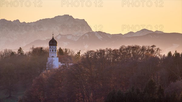 Church St. Johann Baptist protruding from trees