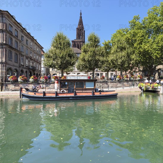 Historic boat on de Ill in front of the Palais Rohan