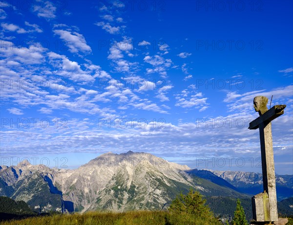 Summit cross of the Rotspielscheibe with view of Watzmann with the east face