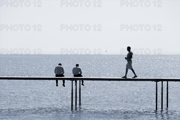 Two men are sitting