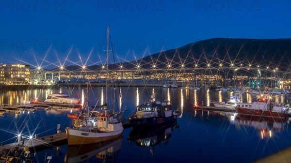 Blue hour in the port of Tromsoe with the bridge