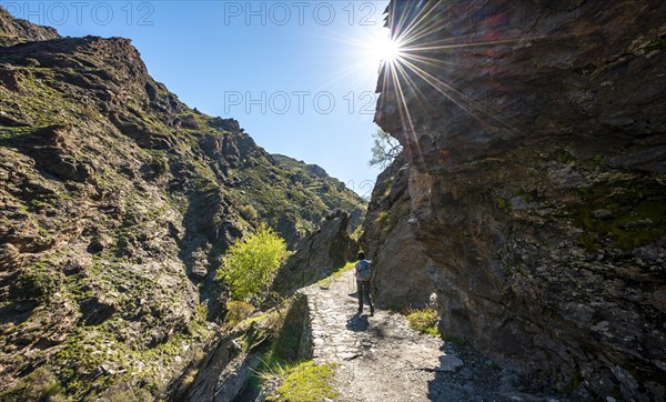 Hiker on hiking trail Vereda de la Estrella