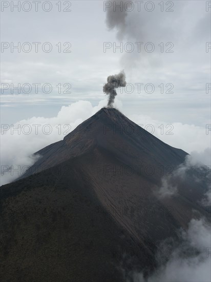Smoke spitting volcano