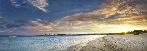Sandy beach beach and coral reef Abu-Dabbab at sunset