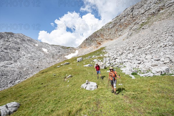 Two hikers on a hiking trail around the Funtenseetauern