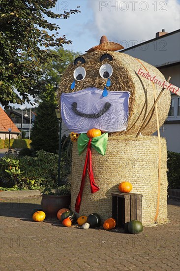 Decorated bale of straw figure for the harvest festival