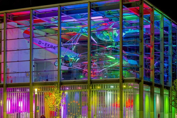 Helicopter museum colourfully illuminated