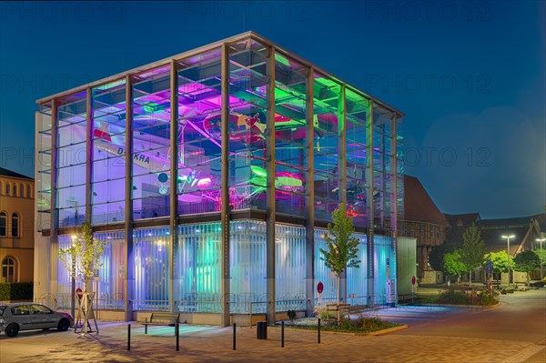 Helicopter museum colourfully illuminated