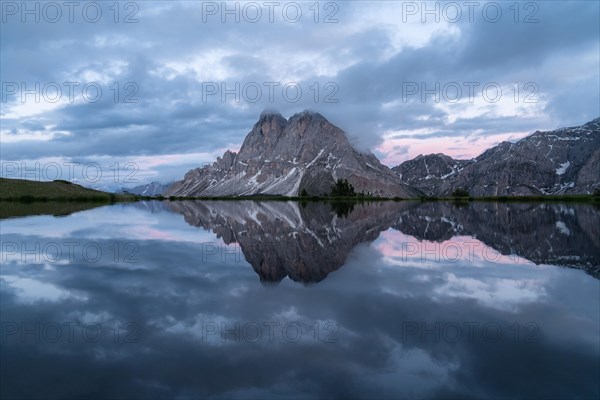 Peitlerkofel with reflection in small lake