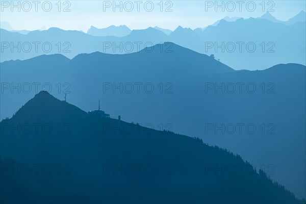 Summit station of the Diedamskopf Bahn at the blue hour with the Allgaeu Alps behind