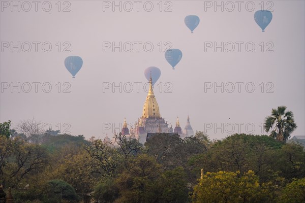 Ananda temple with several colorful balloons