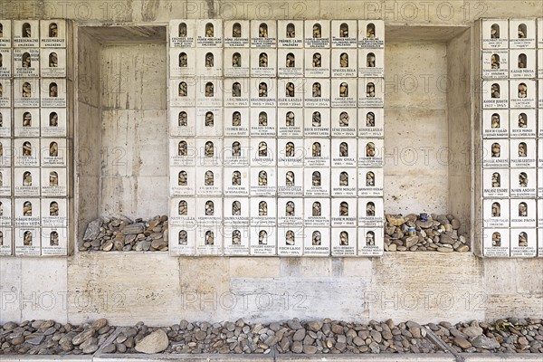 Wall with memorial plaques and deposited stones in memory of the murdered Jews and the Holocaust
