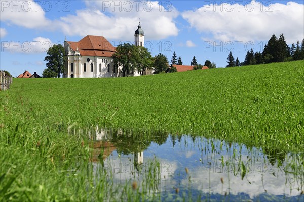 Wieskirche reflected in a puddle