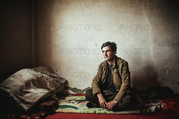 Man sitting on a blanket