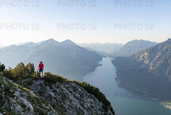 Young man at the summit of Baerenkopf