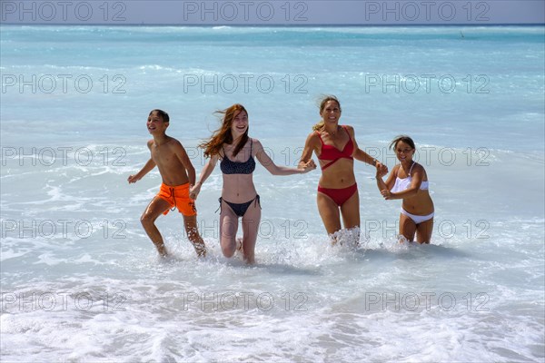 Family in the water bathing