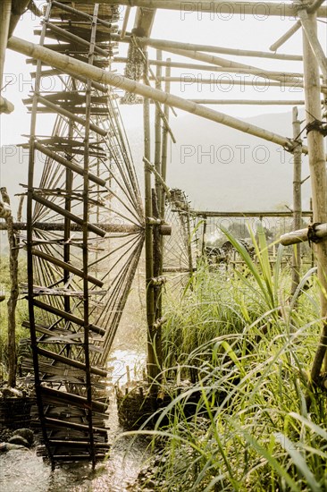 Irrigation of rice paddies with water wheels made of bamboo