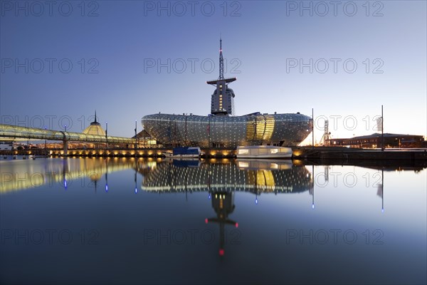 Illuminated Klimahaus Bremerhaven in the evening