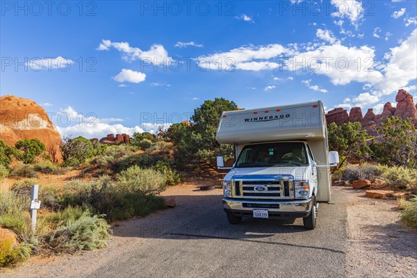 Motorhome in front of rock scenery