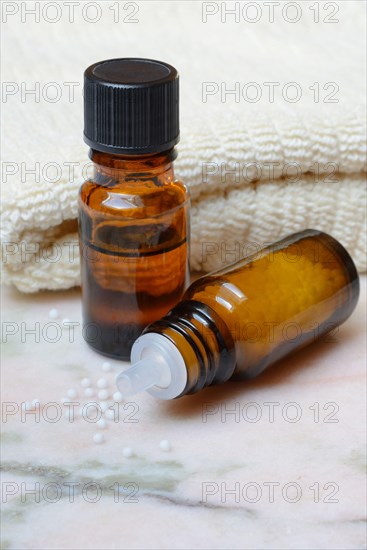Five medicine bottles containing different homeopathic remedies