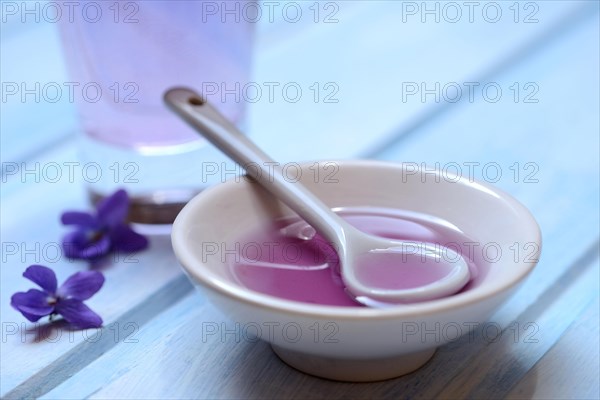 Violet syrup in bowl and glass