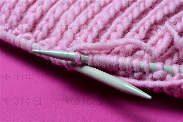 Knitted wool with knitting needles
