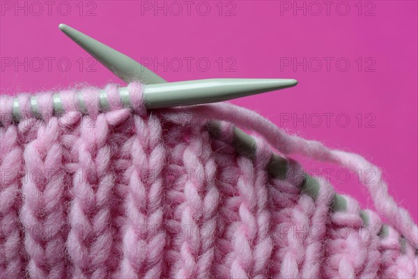 Knitted wool with knitting needles