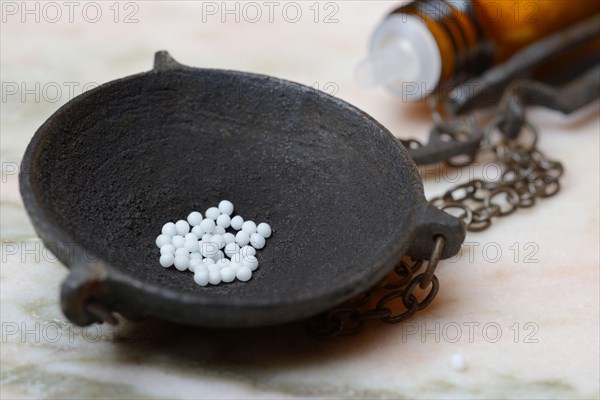 Globules in weighing pan
