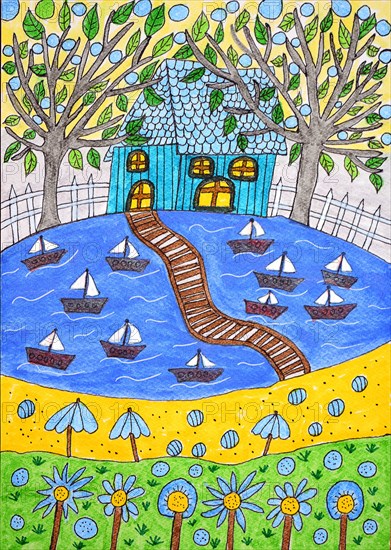 Blue house in the green at the lake