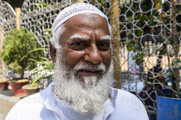 Imam in front of the Star Mosque