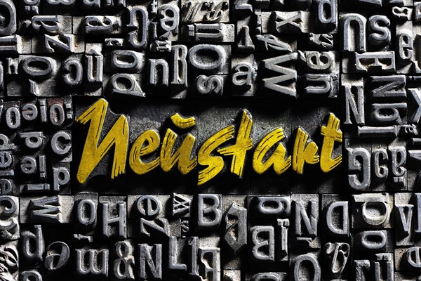 Old lead letters with golden writing