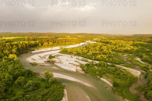 Isar in evening light with rain clouds