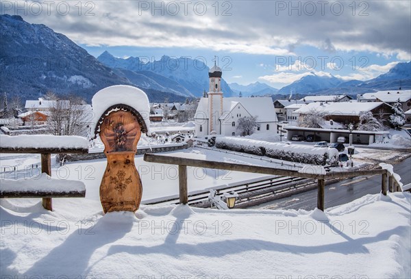 Village view with parish church and Karwendel mountains