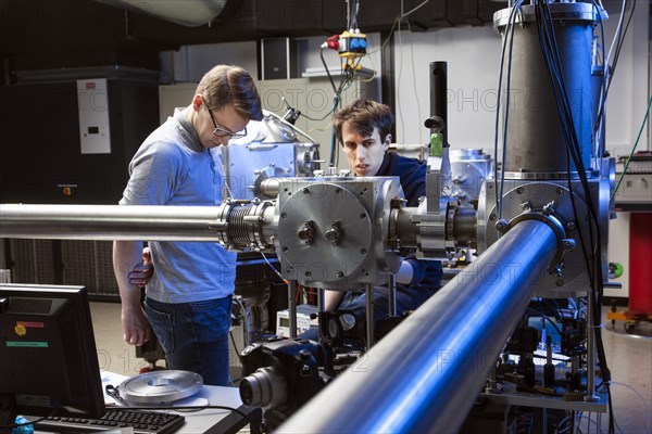 PhD student during his research work adjusting his experimental setup