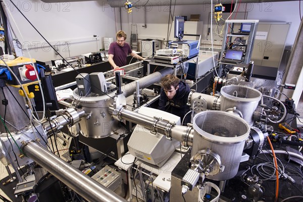 PhD student during his research work adjusting his experimental setup