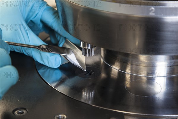 Scientists during their research work on a tablet press at the Institute for Pharmaceutical Technology and Biopharmacy at Heinrich-Heine-University Duesseldorf