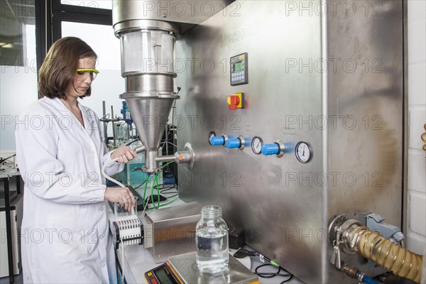 PhD student during her research work on a Huettlin-Mycrolab machine