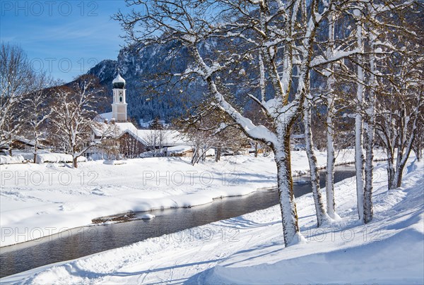 Bank at the river Ammer with parish church