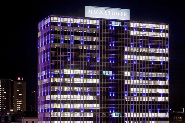 Illuminated Magna Tower in the evening