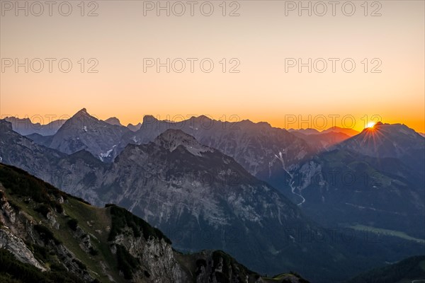 Sunset behind mountain silhouette