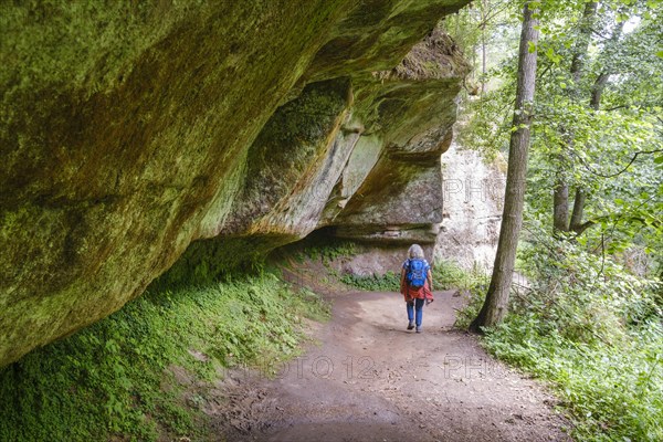 Woman walking on hiking trail in Schwarzachklamm