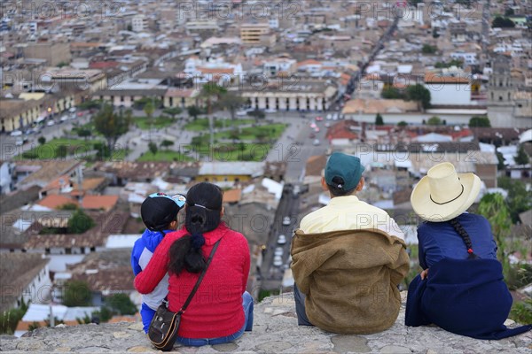 Indigenous family at the Cerro Santa Apolonia viewpoint overlooking the city