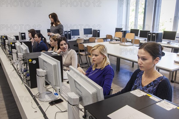 Vocational school students in class at the computer. Dual system at the Elly-Heuss-Knapp-Schule