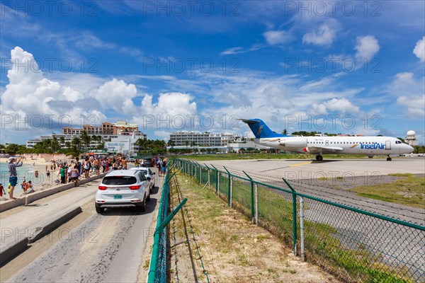 A Fokker 70 of Insel Air with the registration P4-FKC at the airport of St. Maarten