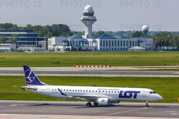 An Embraer 195 of LOT Polskie Linie Lotnicze with the registration SP-LNK at Warsaw Airport